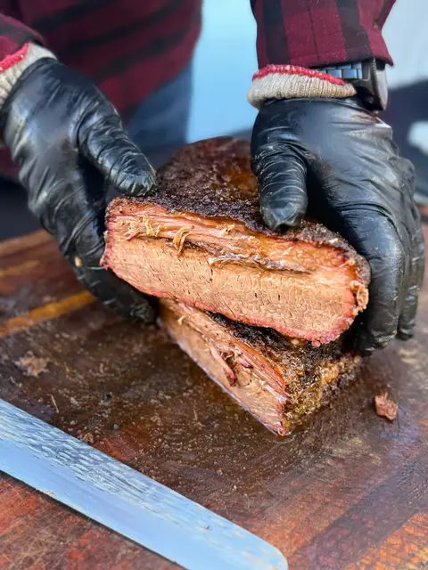 Hand-pulled smoked brisket with a deep bark crust